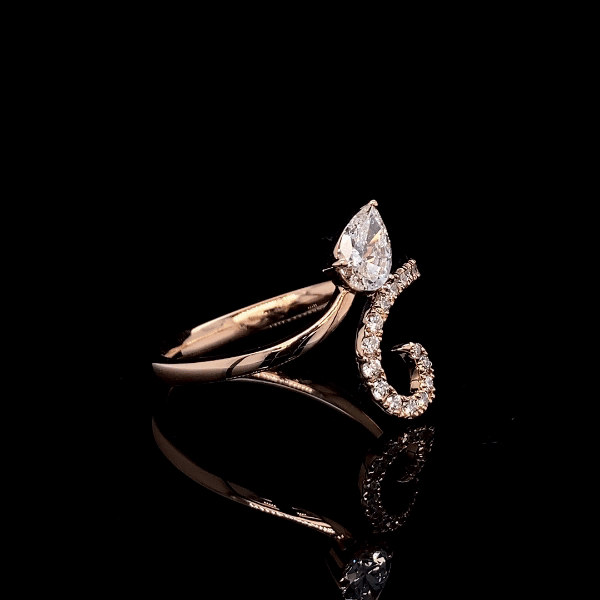 Arc Pear and Round Diamond Ring